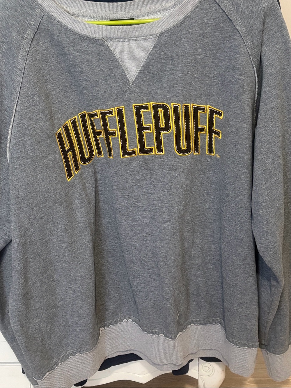 Universal Grey Hufflepuff Sweatshirt with Yellow Lettering
